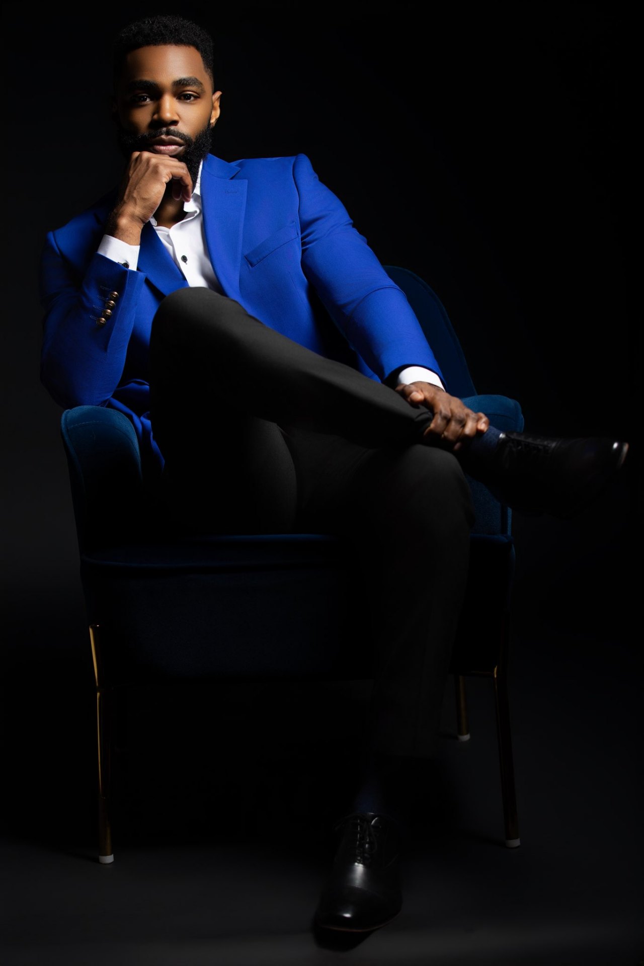 Founder of Ross Talent Agency in a blue blazer